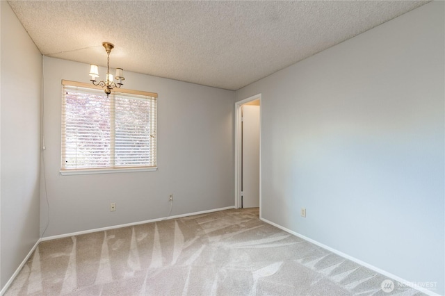 2913 27th St SE, Auburn, WA 98092 - carpeted empty room featuring a chandelier and a textured ceiling