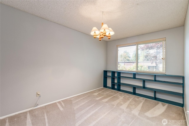 2913 27th St SE, Auburn, WA 98092 - carpeted spare room with a chandelier and a textured ceiling