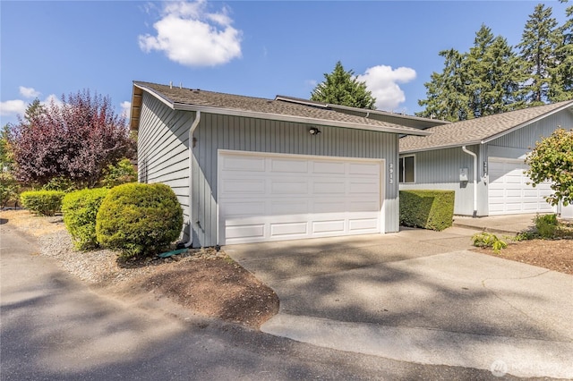2913 27th St SE, Auburn, WA 98092 - view of front of home with concrete driveway and a garage