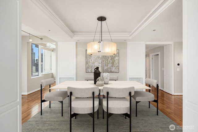 2600 2nd Ave Unit 2501, Seattle, WA 98121 - dining area featuring wood finished floors and a raised ceiling