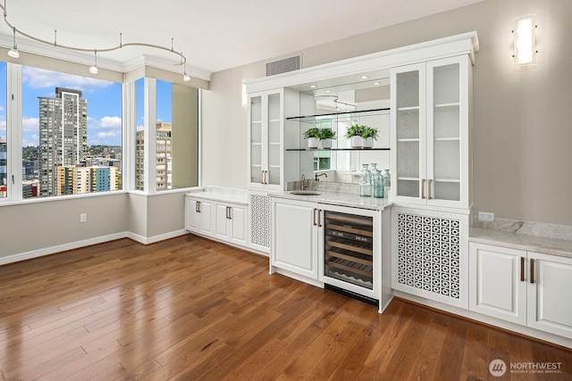 2600 2nd Ave Unit 2501, Seattle, WA 98121 - indoor wet bar with beverage cooler and dark wood finished floors