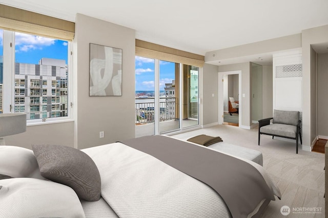 2600 2nd Ave Unit 2501, Seattle, WA 98121 - bedroom with access to exterior, carpet flooring, and a city view