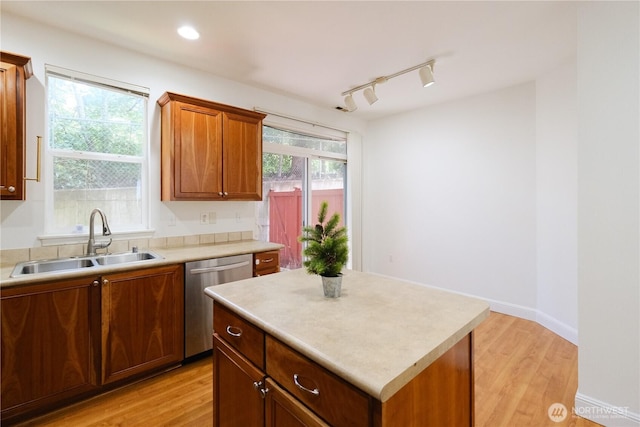 28710 S 34th Ave Unit B5, Auburn, WA 98001 - kitchen featuring stainless steel dishwasher, light wood-style flooring, and light countertops