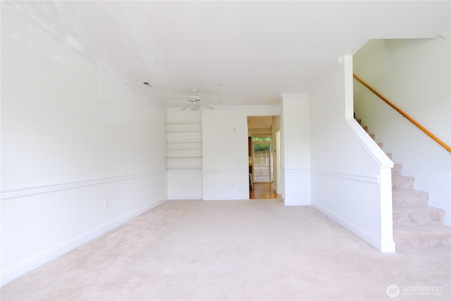 28710 S 34th Ave Unit B5, Auburn, WA 98001 - unfurnished living room with stairs, crown molding, light carpet, ceiling fan, and built in shelves