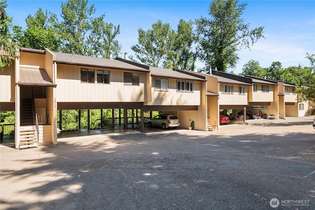 1211 N 8th St Unit 4, Mount Vernon, WA 98273 - view of building exterior with stairs and a carport
