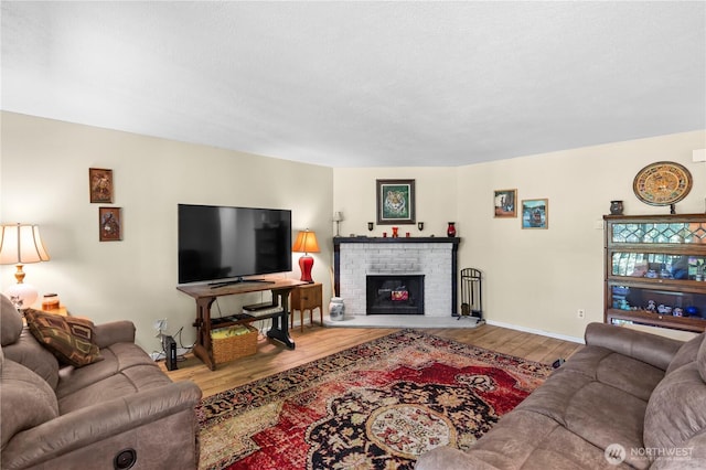 1211 N 8th St Unit 4, Mount Vernon, WA 98273 - living room with wood finished floors and a brick fireplace