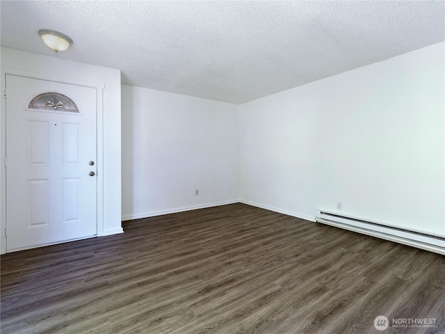 2716 S 256th Pl, Kent, WA 98032 - empty room with dark wood-style flooring, baseboard heating, and a textured ceiling
