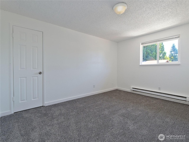 2716 S 256th Pl, Kent, WA 98032 - unfurnished room with a baseboard heating unit, dark carpet, and a textured ceiling