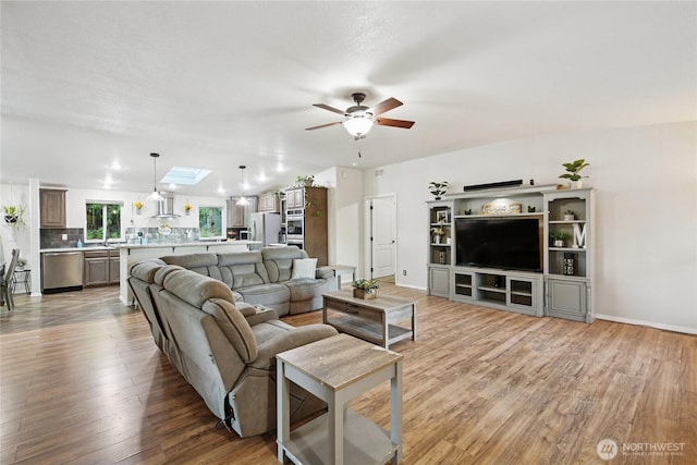 29 Sherburne Rd, Sequim, WA 98382 - living area with ceiling fan, light wood finished floors, and a skylight