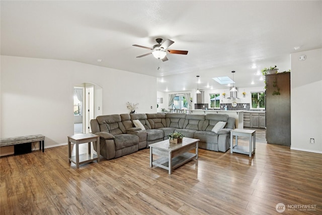 29 Sherburne Rd, Sequim, WA 98382 - living room with ceiling fan, wood finished floors, and arched walkways