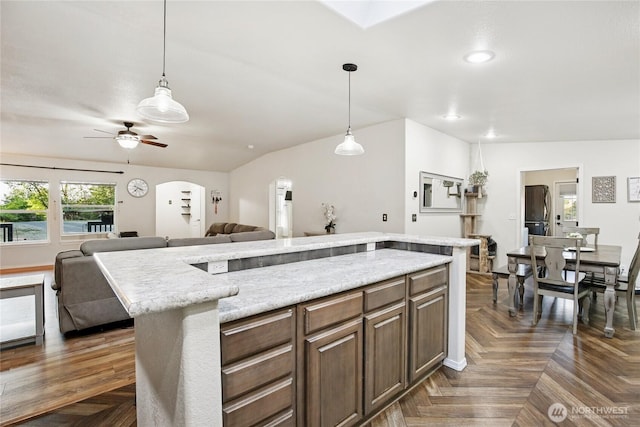 29 Sherburne Rd, Sequim, WA 98382 - kitchen featuring open floor plan, ceiling fan, arched walkways, pendant lighting, and recessed lighting