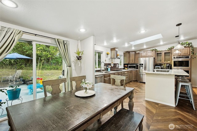 29 Sherburne Rd, Sequim, WA 98382 - dining area with plenty of natural light, a skylight, recessed lighting, and vaulted ceiling