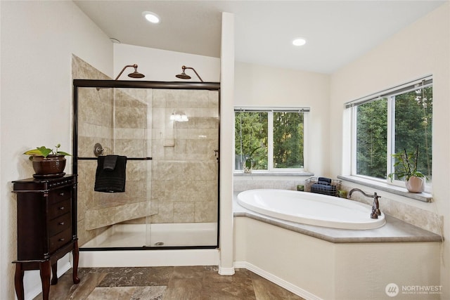 29 Sherburne Rd, Sequim, WA 98382 - bathroom featuring a garden tub, a stall shower, stone finish flooring, and recessed lighting