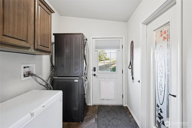 29 Sherburne Rd, Sequim, WA 98382 - washroom with cabinet space, stacked washer and clothes dryer, and dark wood-type flooring