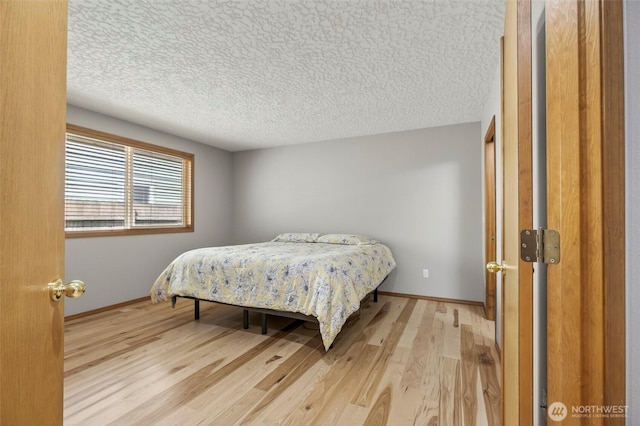 13019 NE 96th Way, Vancouver, WA 98682 - bedroom with wood finished floors and a textured ceiling