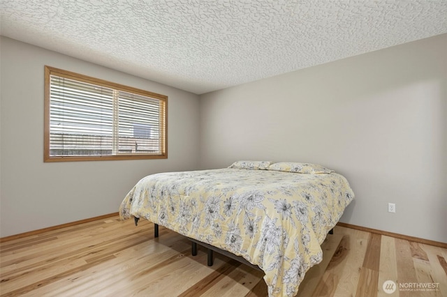 13019 NE 96th Way, Vancouver, WA 98682 - bedroom with wood finished floors and a textured ceiling