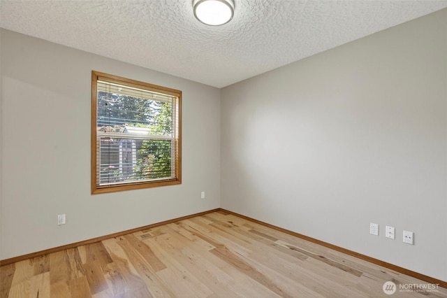 13019 NE 96th Way, Vancouver, WA 98682 - unfurnished room with light wood finished floors and a textured ceiling