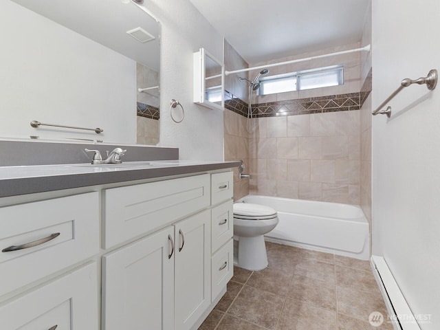 2705 181st Ave E, Lake Tapps, WA 98391 - bathroom with a baseboard radiator, vanity, bathing tub / shower combination, and tile patterned floors