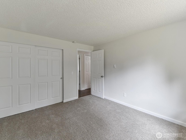 2705 181st Ave E, Lake Tapps, WA 98391 - unfurnished bedroom with carpet, a closet, and a textured ceiling