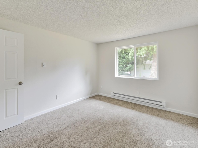 2705 181st Ave E, Lake Tapps, WA 98391 - empty room with a baseboard heating unit, carpet flooring, and a textured ceiling