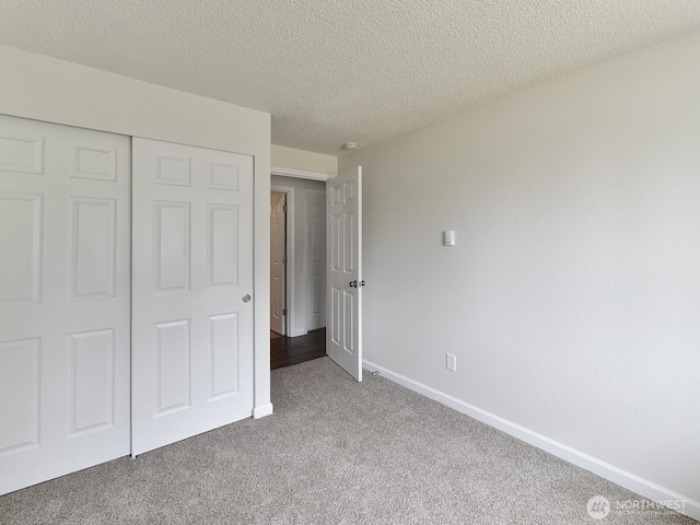 2705 181st Ave E, Lake Tapps, WA 98391 - unfurnished bedroom with carpet, a closet, and a textured ceiling