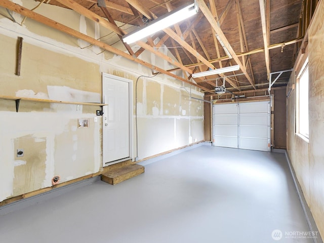 2705 181st Ave E, Lake Tapps, WA 98391 - garage featuring a garage door opener