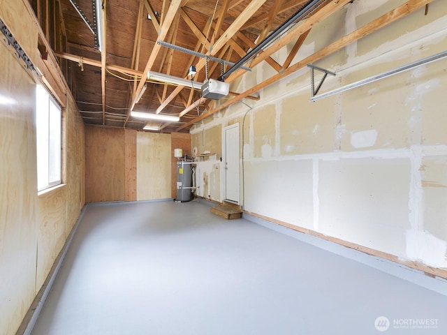 2705 181st Ave E, Lake Tapps, WA 98391 - garage with secured water heater and a garage door opener