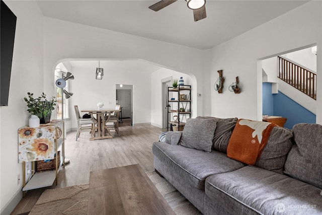 3738 E J St, Tacoma, WA 98404 - living area with ceiling fan, arched walkways, wood finished floors, and stairway