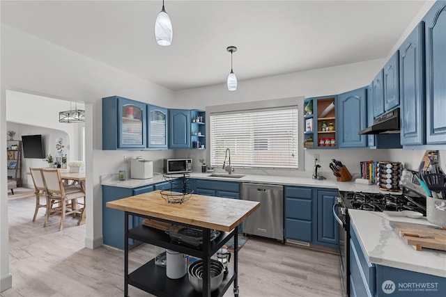 3738 E J St, Tacoma, WA 98404 - kitchen with appliances with stainless steel finishes, open shelves, blue cabinets, and under cabinet range hood