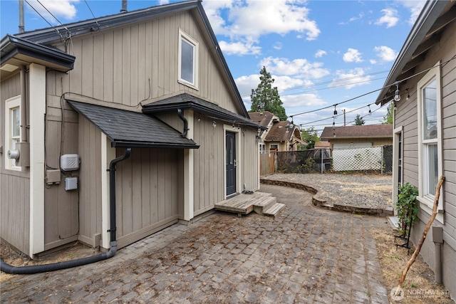 3738 E J St, Tacoma, WA 98404 - back of house with a patio and a shingled roof