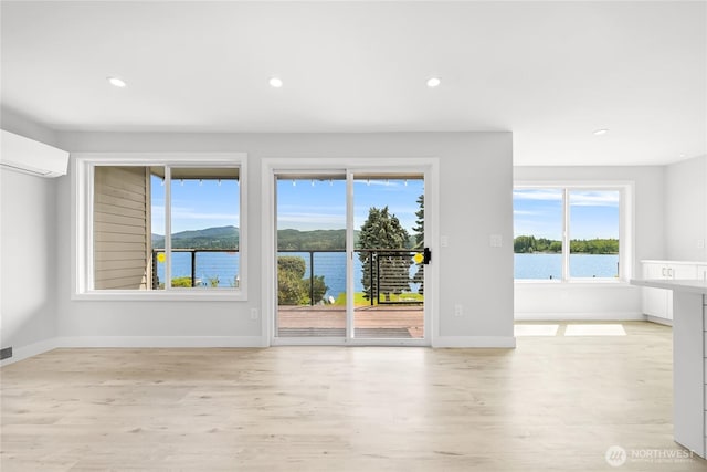610 Northshore Dr Unit 6123, Bellingham, WA 98226 - unfurnished room with plenty of natural light, wood finished floors, a wall unit AC, and recessed lighting