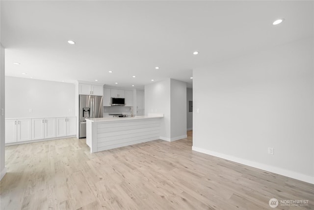 610 Northshore Dr Unit 6123, Bellingham, WA 98226 - unfurnished living room featuring recessed lighting and light wood-style floors