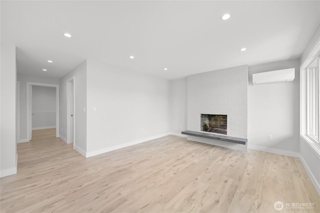 610 Northshore Dr Unit 6123, Bellingham, WA 98226 - unfurnished living room with light wood finished floors, recessed lighting, a fireplace, and an AC wall unit