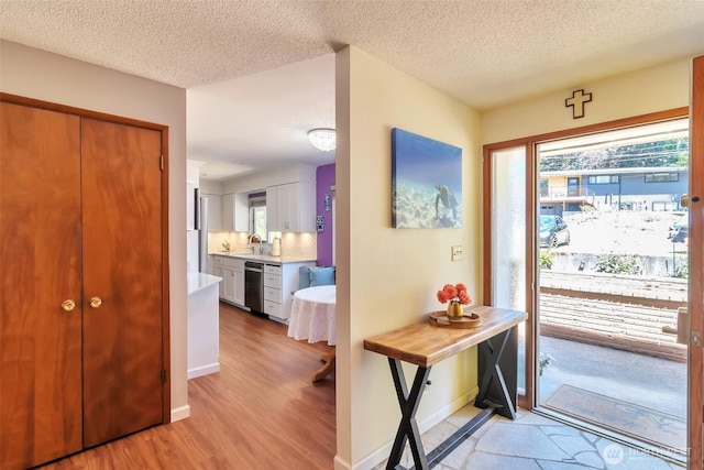 1515 NE 106th St, Seattle, WA 98125 - foyer entrance with light wood-type flooring and a textured ceiling