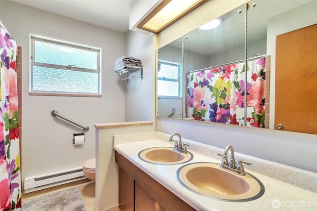 1515 NE 106th St, Seattle, WA 98125 - bathroom featuring baseboard heating, double vanity, and a shower with curtain