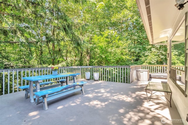 1515 NE 106th St, Seattle, WA 98125 - view of patio featuring outdoor dining area and a view of trees