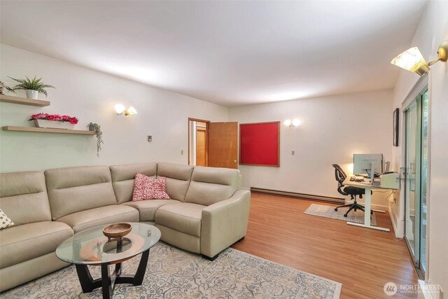 1515 NE 106th St, Seattle, WA 98125 - living area with baseboard heating, light wood-style floors, and a desk