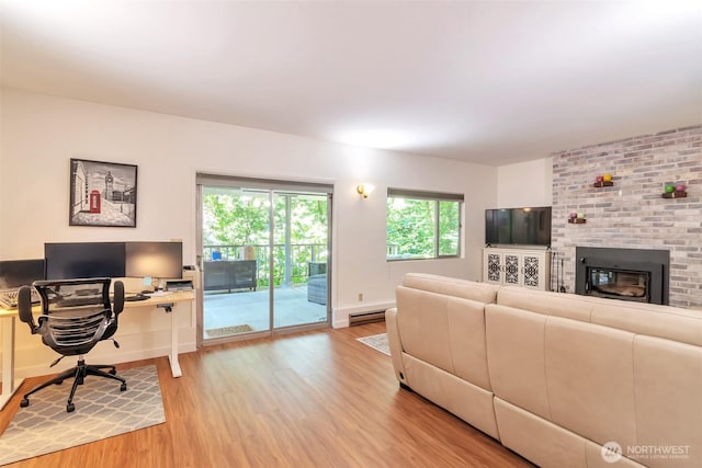 1515 NE 106th St, Seattle, WA 98125 - living area with light wood-type flooring, plenty of natural light, and an office area