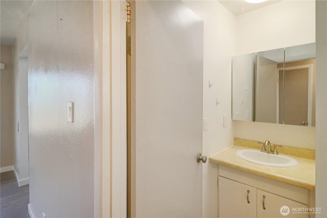 837 NW Duffy St, Chehalis, WA 98532 - bathroom featuring vanity and wood finished floors