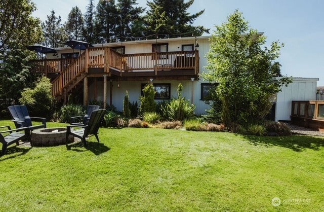 1327 Marie View St, Port Angeles, WA 98363 - rear view of property with an outdoor fire pit, a lawn, a wooden deck, and stairway