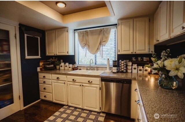 1327 Marie View St, Port Angeles, WA 98363 - kitchen featuring stainless steel dishwasher, a tray ceiling, white cabinetry, and dark wood-type flooring