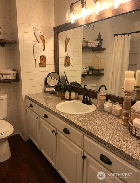 1327 Marie View St, Port Angeles, WA 98363 - full bathroom featuring vanity, curtained shower, and wood finished floors