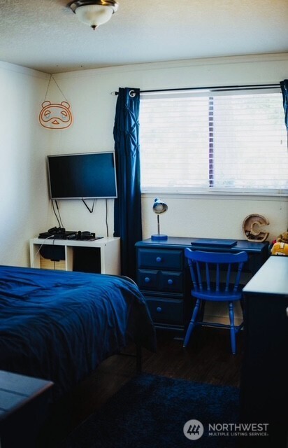 1327 Marie View St, Port Angeles, WA 98363 - bedroom featuring wood finished floors and a textured ceiling