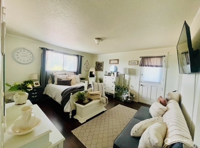 1327 Marie View St, Port Angeles, WA 98363 - bedroom with dark wood finished floors, crown molding, and a textured ceiling