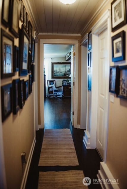 1327 Marie View St, Port Angeles, WA 98363 - hallway with ornamental molding, dark wood finished floors, and wood ceiling