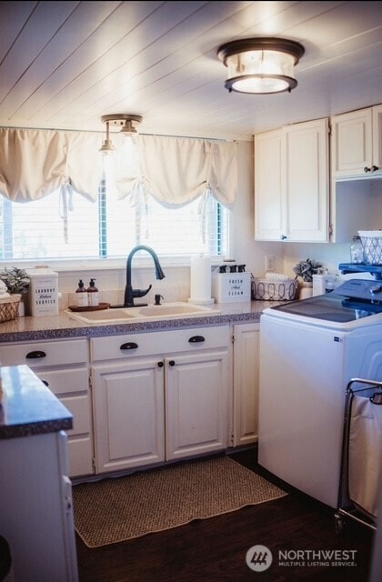 1327 Marie View St, Port Angeles, WA 98363 - laundry area with cabinet space and dark wood-style floors