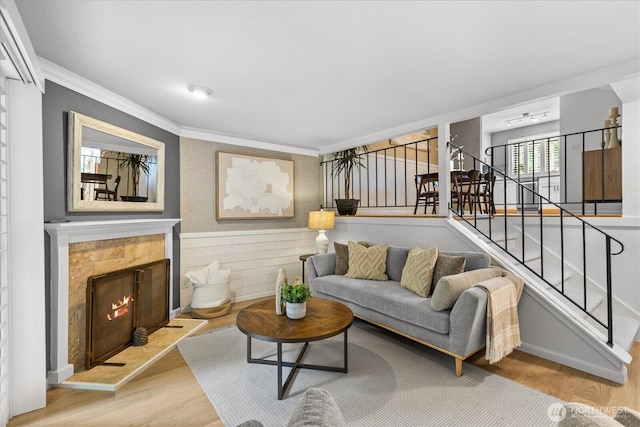 728 NW 189th Ln, Shoreline, WA 98177 - living area with crown molding, stairway, wood finished floors, and a tile fireplace