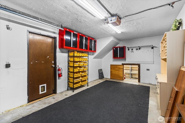 728 NW 189th Ln, Shoreline, WA 98177 - garage featuring a workshop area and a garage door opener