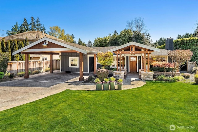 10261 NE 21st Pl, Bellevue, WA 98004 - view of front facade with concrete driveway, a chimney, a carport, and board and batten siding