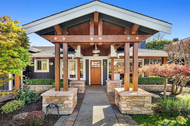 10261 NE 21st Pl, Bellevue, WA 98004 - entrance to property with board and batten siding, a porch, and roof with shingles